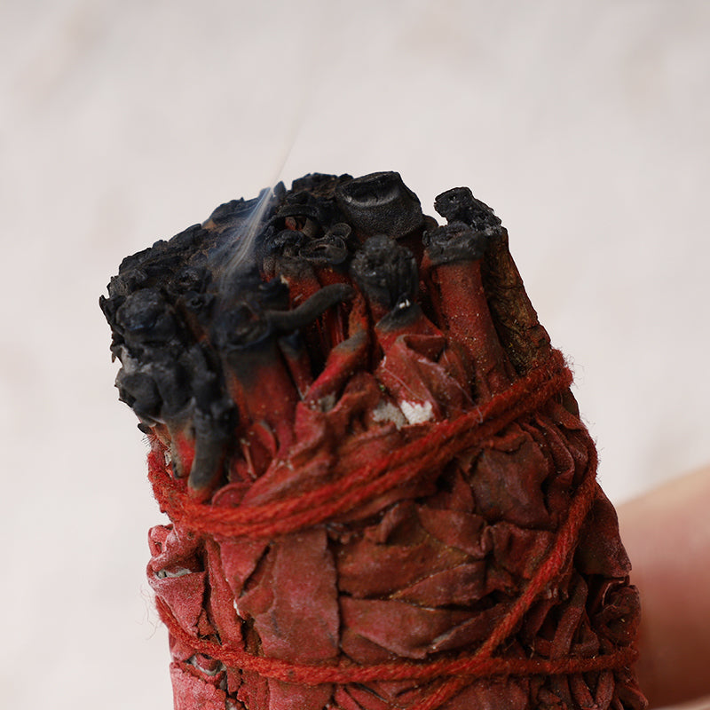 Dragon's Blood sage smudge – lit bundle with rising smoke, spiritual