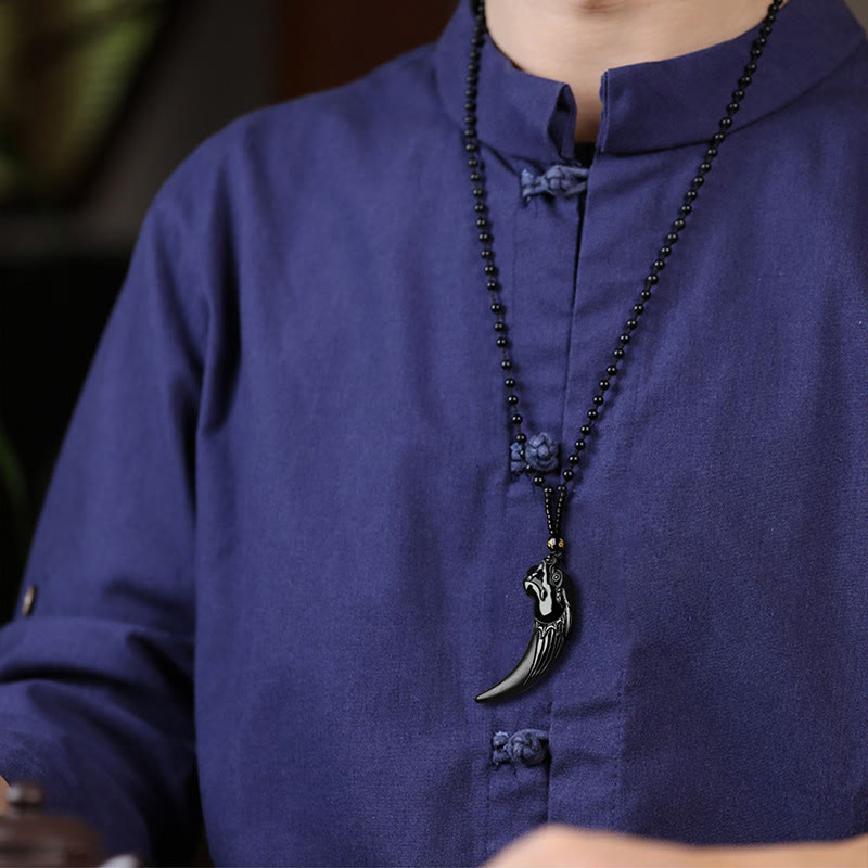 Black Jade Dragon Tooth Pendant – worn on indigo mandarin collar shirt, lifestyle cultural styling, bold statement