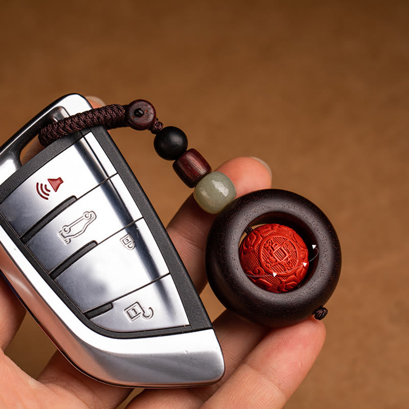 Tibetan Om Mani Padme Hum Sandalwood Cinnabar Protection Keychain – hand holding car key with mantra bead, cinnabar keychain