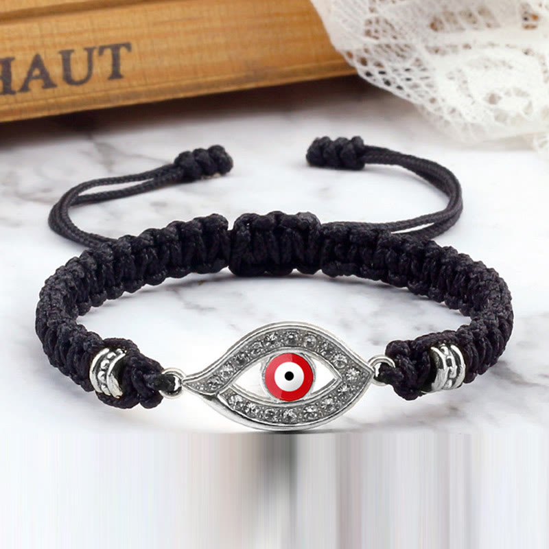 Black cord evil eye bracelet with silver red evil eye crystal charm, marble styling
