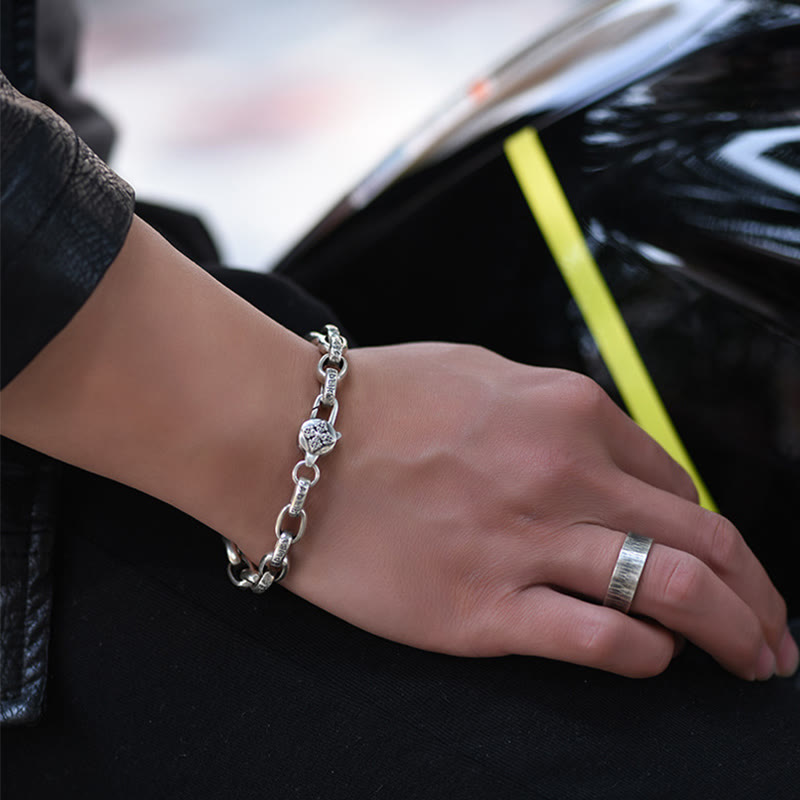 Double Dorje Wisdom Bracelet - Worn with silver ring and leather jacket, automotive lifestyle scene