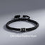 Om Mani Padme Hum Braided Peace Bracelet – flat lay with engraved silver charm, silver braid bracelet