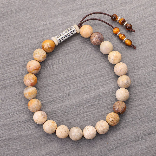Weathered Stone Om Mani Padme Hum Bracelet – top-down view of full bracelet circle with sliding knot, beaded mala