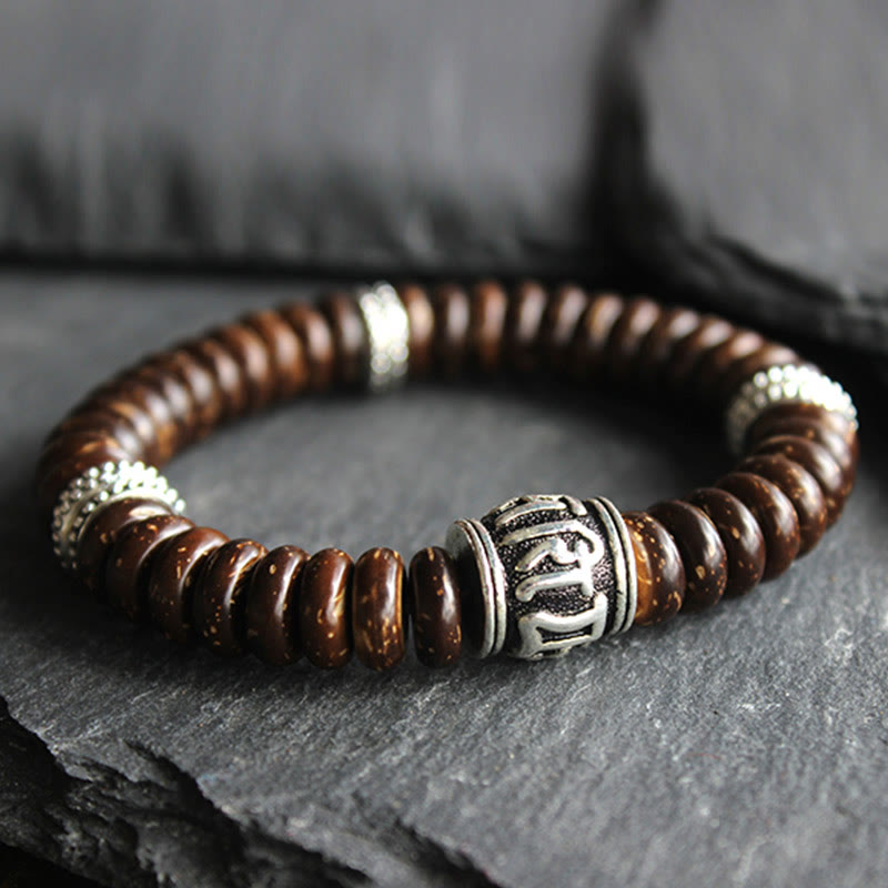 Om Mani Padme Hum Coconut Shell Bracelet – low-angle close-up on slate, men's bead bracelet
