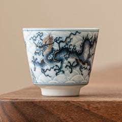 Blue & White Dragon Ceramic Teacup – single cup on walnut wood, cobalt blue dragon detail, handcrafted