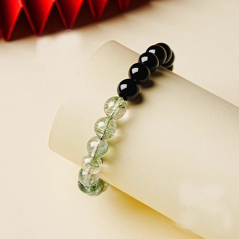 Obsidian Green Phantom Bracelet – draped on cream scroll with red fan accent, prosperity bracelet