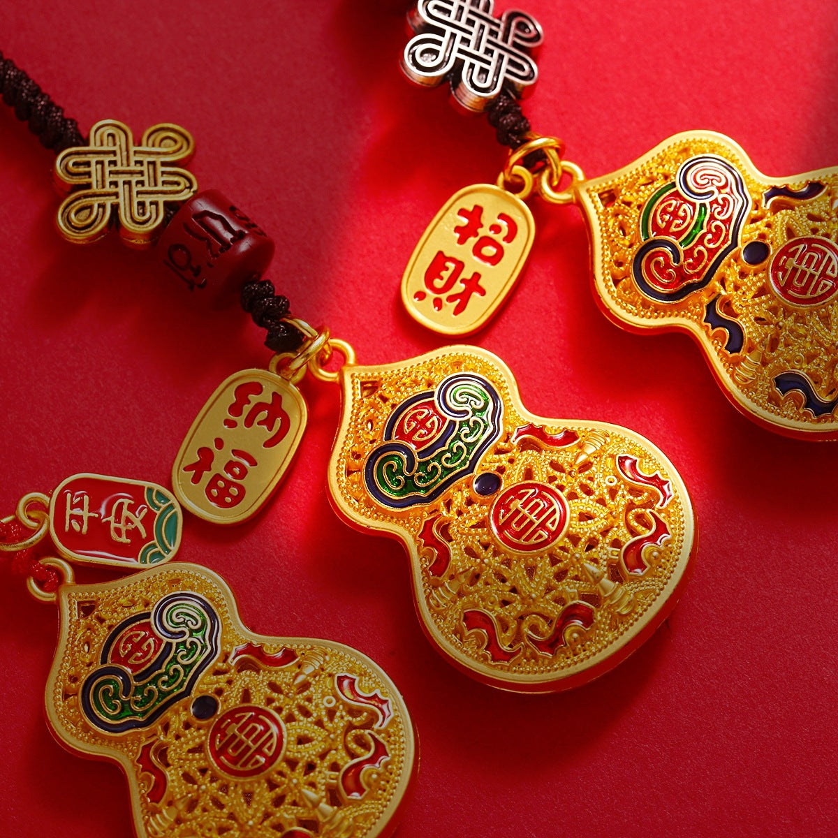 Gold rotating calabash disc keychain with peace talisman attached to car key, white background