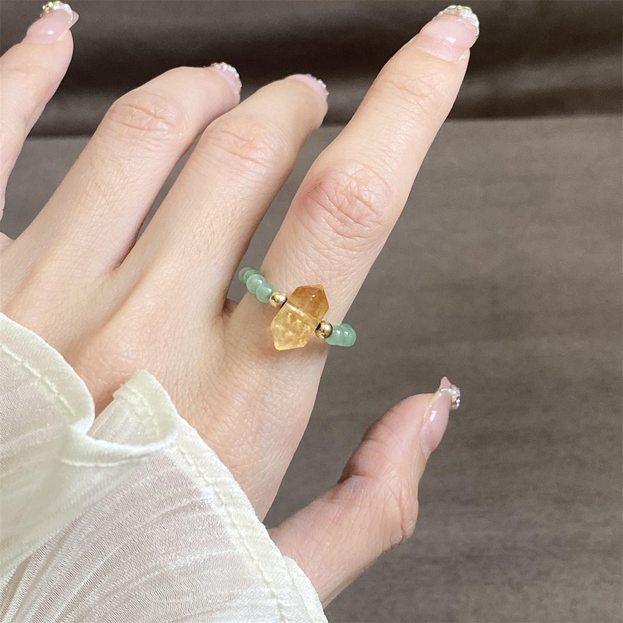 Citrine Aventurine Ring – Close-up of citrine double-point ring with aventurine beads on hand, feng shui jewelry