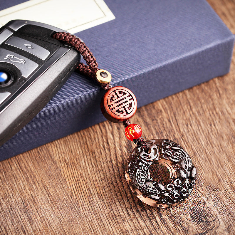 Pixiu Obsidian Keychain – pixiu charm attached to BMW car key beside blue gift box, luxury feng shui keychain