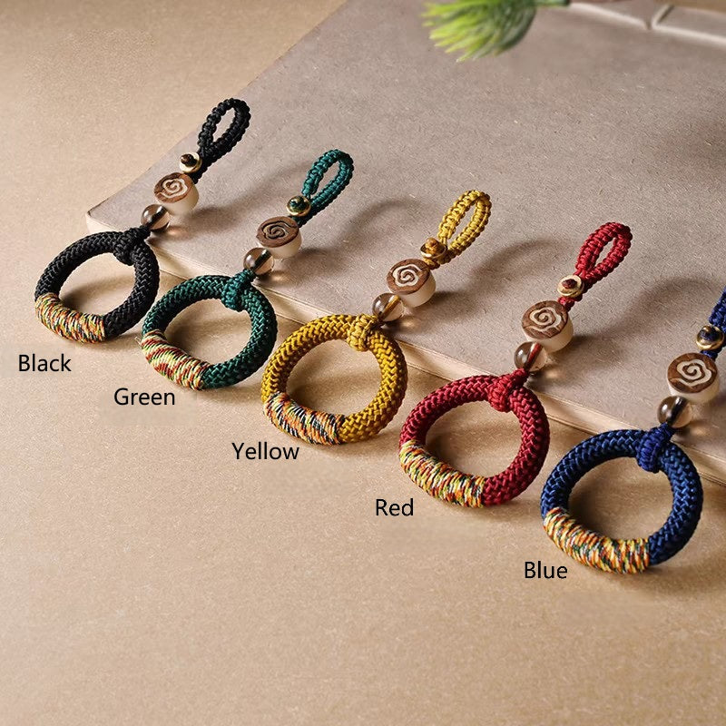 Handwoven Feng Shui Macrame Keychain – Green, angled view, lucky charm