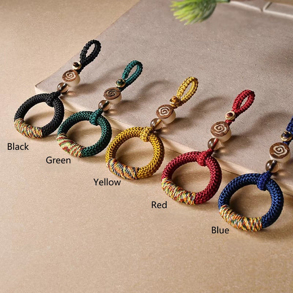 Handwoven Feng Shui Macrame Keychain – Green, angled view, lucky charm