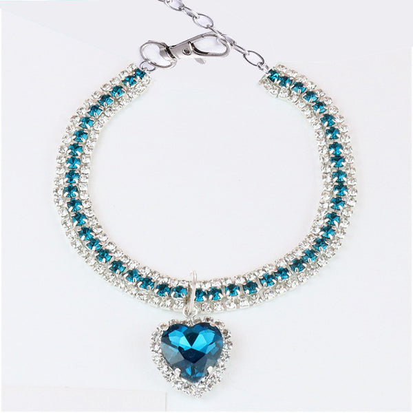 Heart Crystal Pet Collar – triple row teal blue crystals with blue heart pendant, halo setting, flat lay