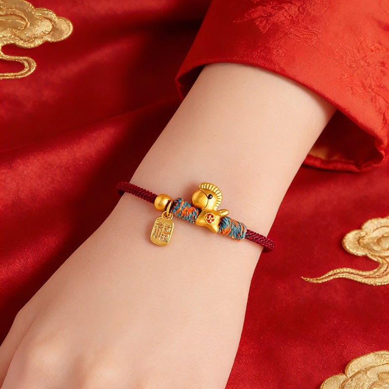 Year of the Horse Bracelet – Wrist model wearing red gold horse on red silk, festive jewelry