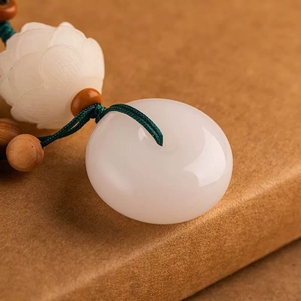 Chalcedony Lotus Keychain – close-up of smooth white peace buckle and carved lotus bead detail, crystal keychain