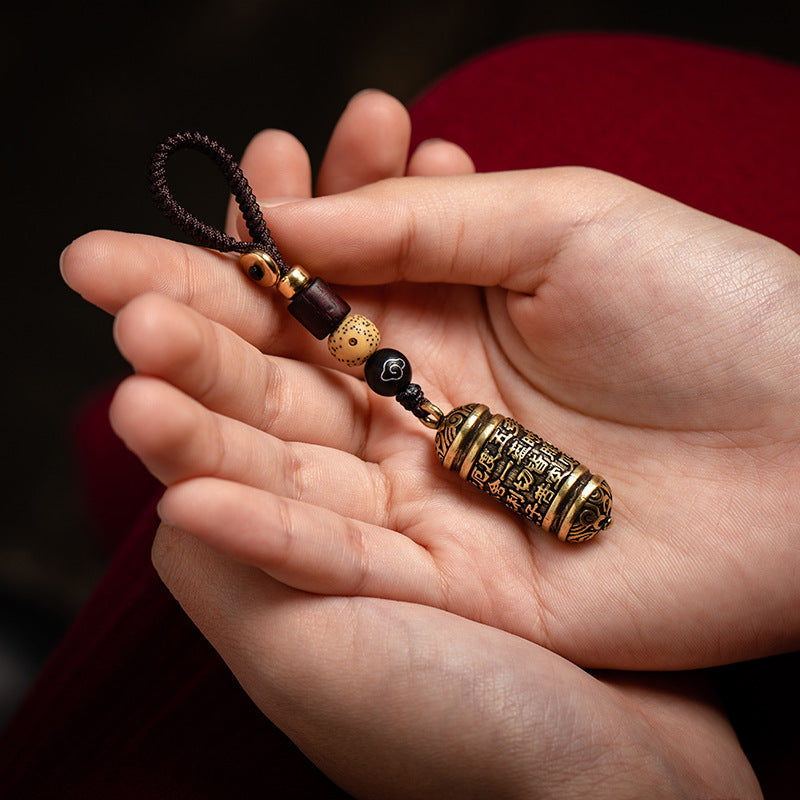 Tibetan Om Mani Padme Hum Brass Car Ornament, lifestyle shot