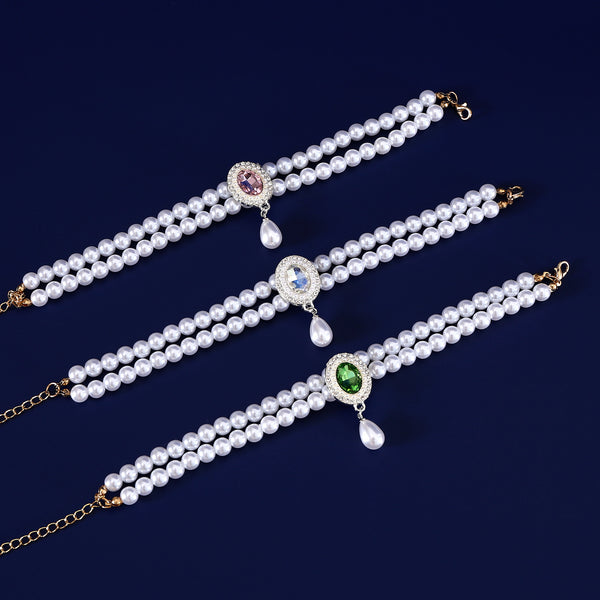 Luxury Pearl Pet Necklace – Three double-layer pearl collars with pink, blue and green crystal pendants, flat lay