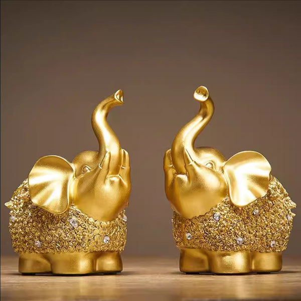Lucky Elephant Statue – golden elephants with crystal details and raised trunks on wood, prosperity decor