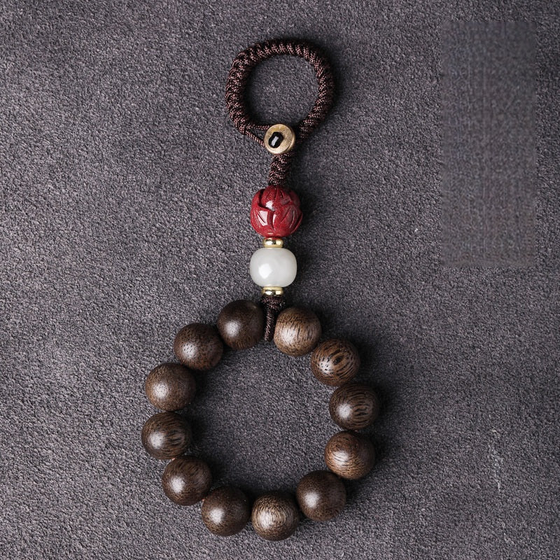 Agarwood & Hetian Jade Lotus Car Keychain, side view, lucky charm