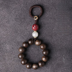 Agarwood & Hetian Jade Lotus Car Keychain, side view, lucky charm