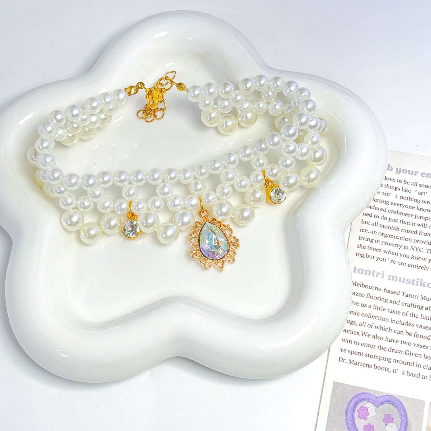Luxury Pearl Pet Necklace - Green gemstone pendant with pearl choker on ceramic cloud dish, luxury crystal pet collar
