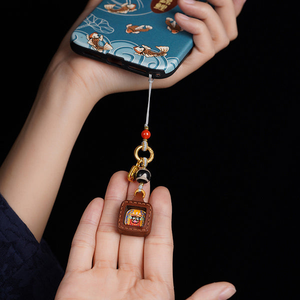 Tibetan Zakiram Thangka Amulet Keychain, side view, lucky charm