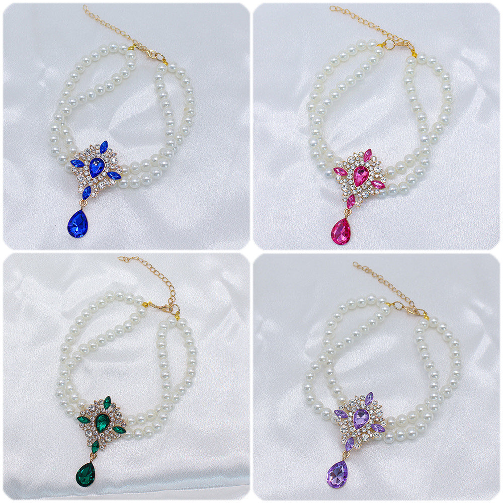 Elegant Pearl Crystal Collar – Four color variants blue, pink, green, purple on white satin background