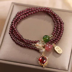 Garnet triple-wrap bracelet with fox head pendant red stone eye gold-toned ear details and zhao cai wealth-attracting plaque charm with green jade pink quartz and citrine accent beads
