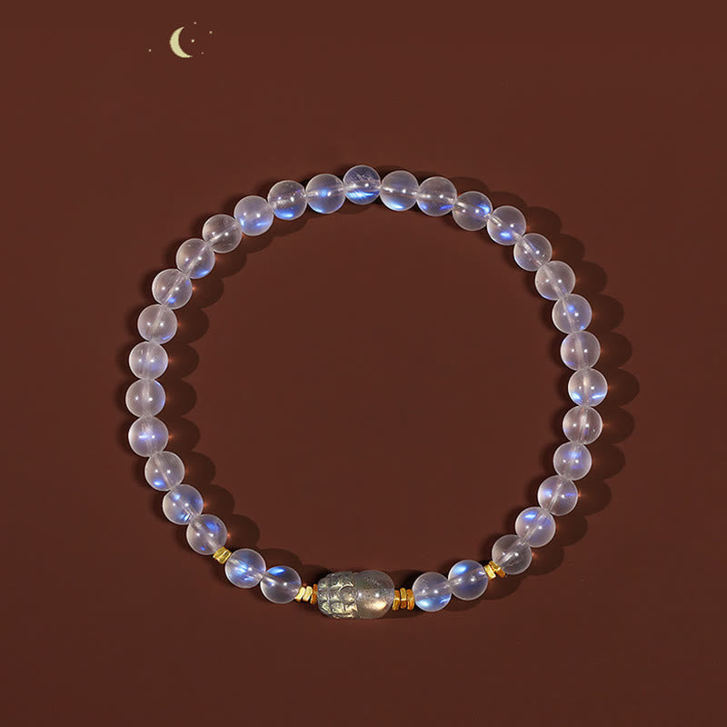Moonstone PiXiu Bracelet – Full circle moonstone beads with PiXiu on brown background with moon, serenity