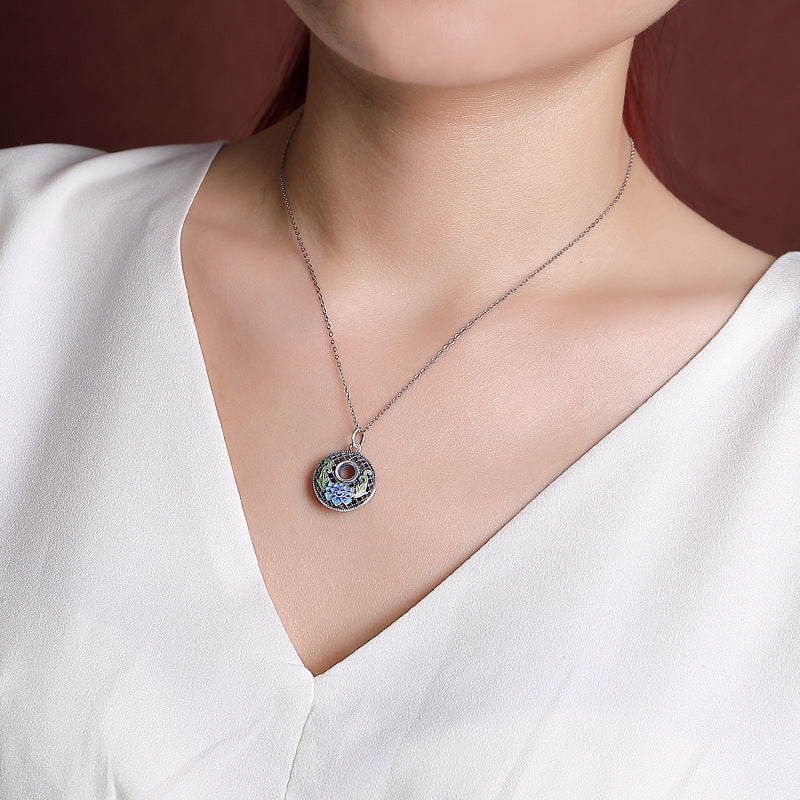 999 Silver Koi Lotus Necklace – macro shot of silver texture and polish, peace buckle
