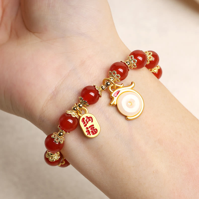 Red Agate Aventurine Dragon Bracelet – Red agate worn on wrist showing gold blessing charms, Wearable