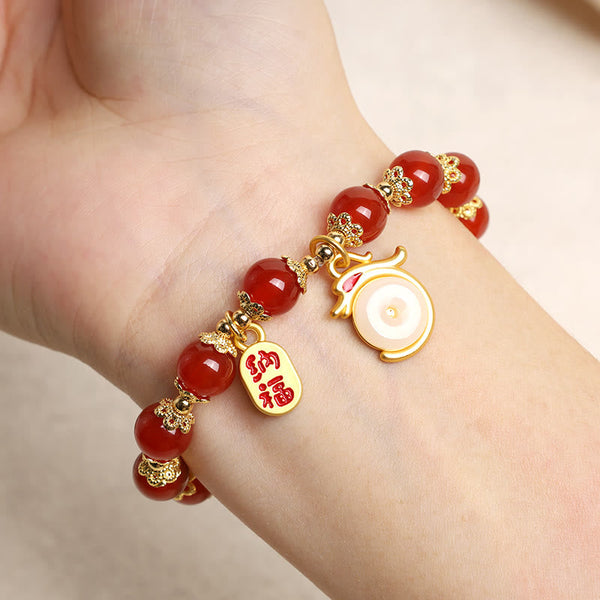 Red Agate Aventurine Dragon Bracelet – Red agate worn on wrist showing gold blessing charms, Wearable