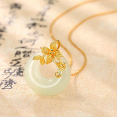 Tibetan White Jade Calm Necklace - angled view with traditional calligraphy, white jade bi disc