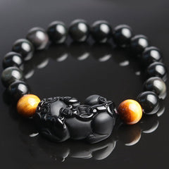 FengShui PiXiu Rainbow Obsidian Bracelet – bracelet flat lay showing PiXiu centerpiece, glossy black beads, golden tiger eye