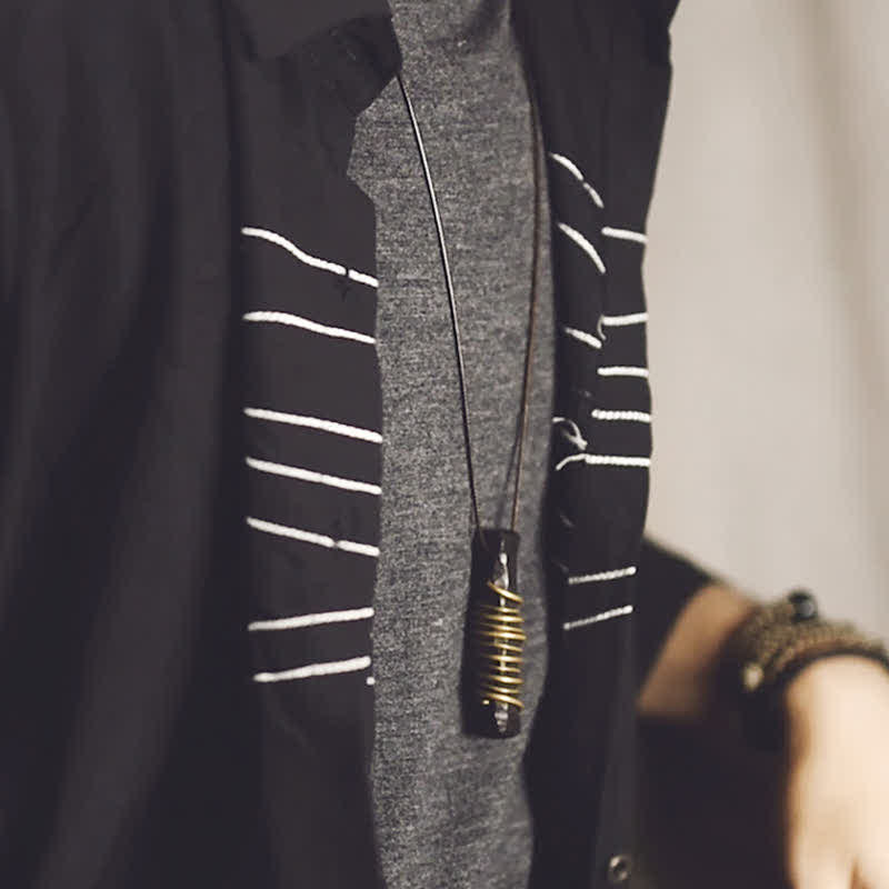 Ebony Wood Pendant Necklace – Worn layered style, wire wrapped stone on dark outfit, zen jewelry