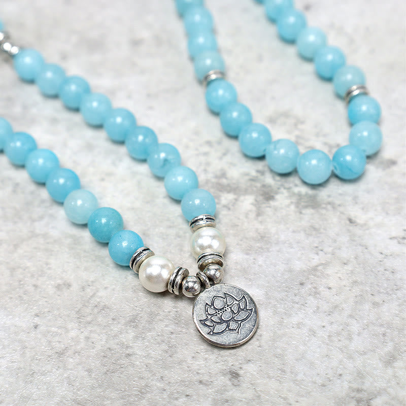 Amazonite Lotus Mala close-up of silver lotus pendant with blue beads and pearls, healing