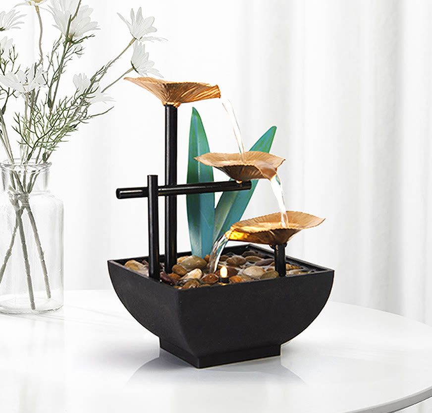 Three Layers Lotus Waterfall Fountain - Copper lotus tiers with green leaves on wood table, Mindful