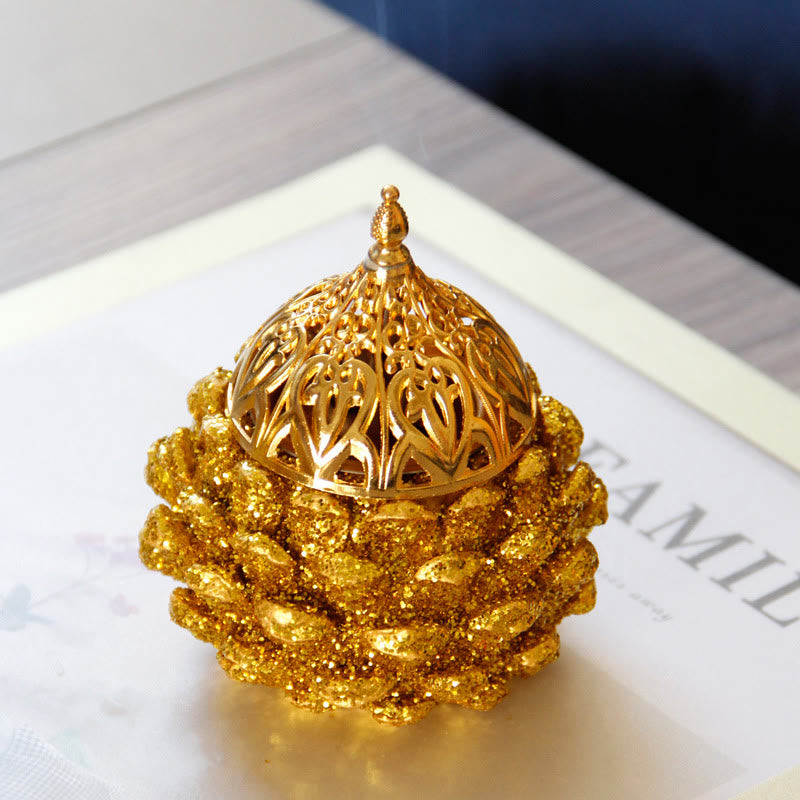 Gold Pine Cone Mini Incense Burner - Assembled unit on textured base, cream surface, mindful living