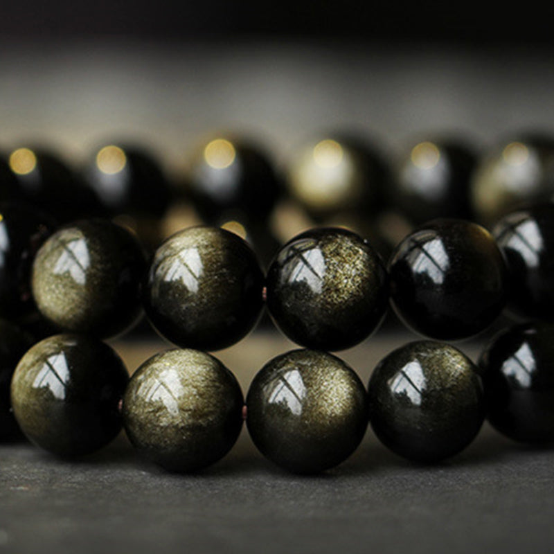 Zodiac Natal Buddha Obsidian Silver Bracelet - Coiled obsidian strands highlighting golden chatoyant flash