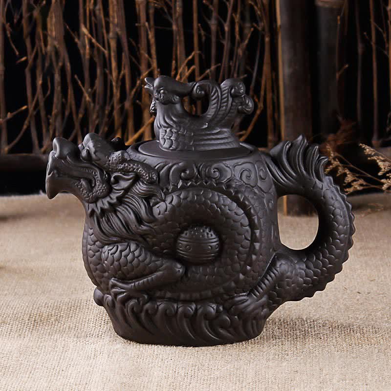 Vintage Dragon Phoenix Purple Clay Teapot – black zisha dragon teapot on burlap with bamboo backdrop, handcrafted sculpture