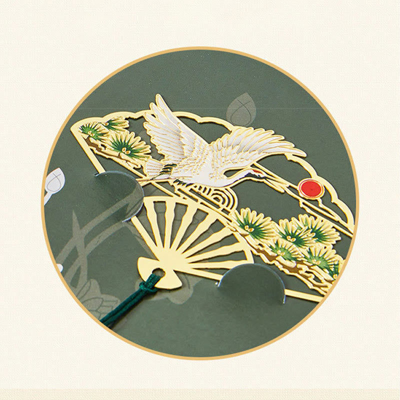 Brass Hollow Fan Bookmark - Crane and pine cutout with green tassel on circular back, serene