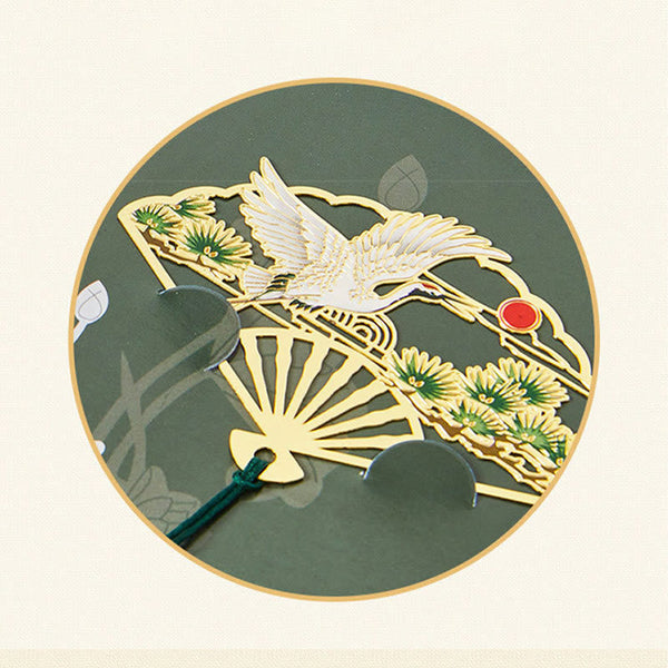 Brass Hollow Fan Bookmark - Crane and pine cutout with green tassel on circular back, serene
