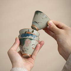 Persimmon Boat Koi Teacup – front view of ceramic cup with koi and lotus, kung fu tea