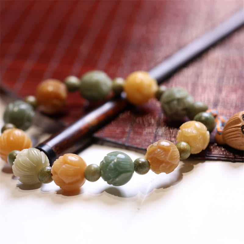 Bodhi Seed Green Sandalwood Lotus Bracelet – multi-color lotus beads beside wooden stick, Harmonious