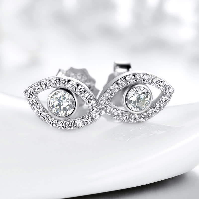 Evil Eye Bundle – Sterling silver evil eye earrings with clear crystals on white curved display surface