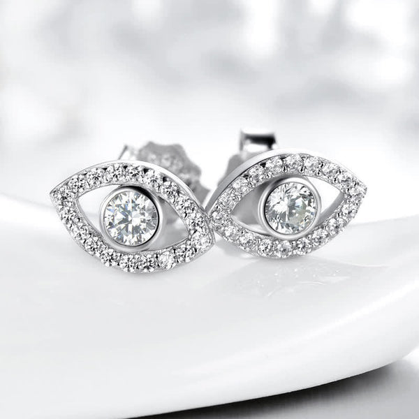 Evil Eye Bundle – Sterling silver evil eye earrings with clear crystals on white curved display surface