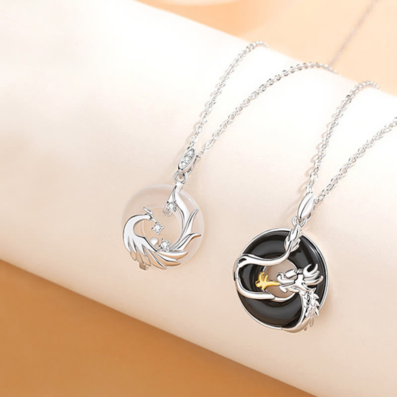 Black Onyx Dragon Phoenix Pendant - openwork dragon phoenix circular pendants with gold detail, Protection