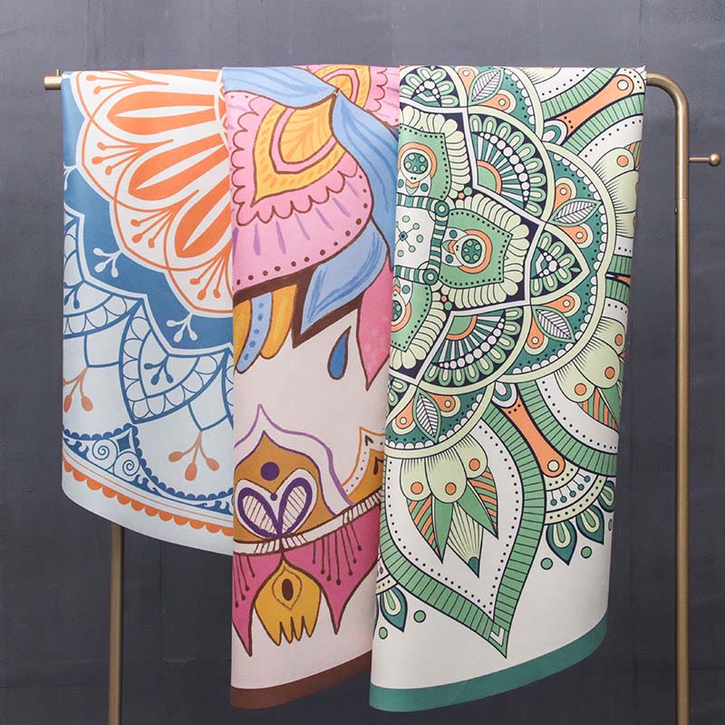 Tibetan Lotus Mandala Yoga Mat three colorful towels on brass rack, mandala and elephant boho prints, yoga studio