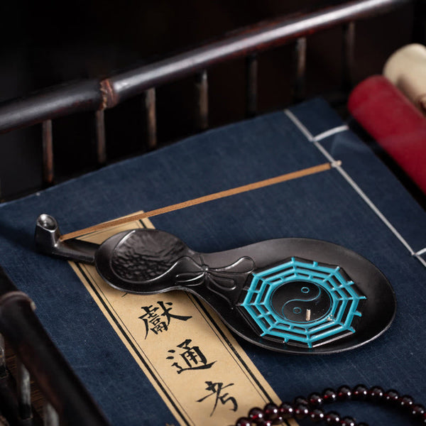 Gourd Yin Yang Bagua Incense Burner – Teal Bagua inlay on blue thread-bound book with incense stick, copper burner