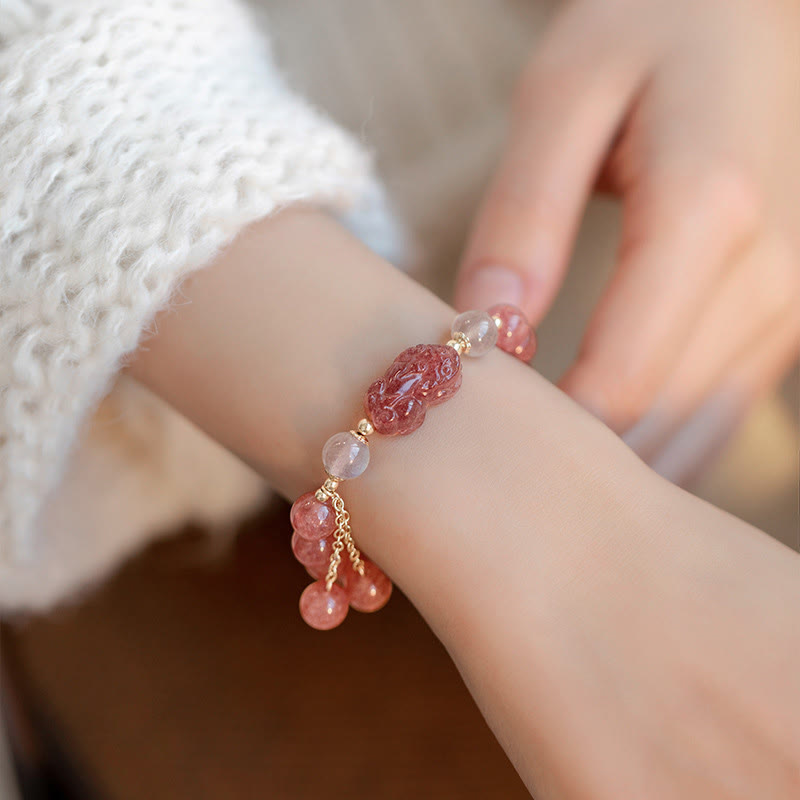 Strawberry Quartz Moonstone Bracelet – model wrist white knit sweater, pink PiXiu detail, love healing