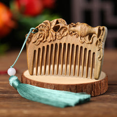Green sandalwood comb carved with horse and peony flower design with blue tassel